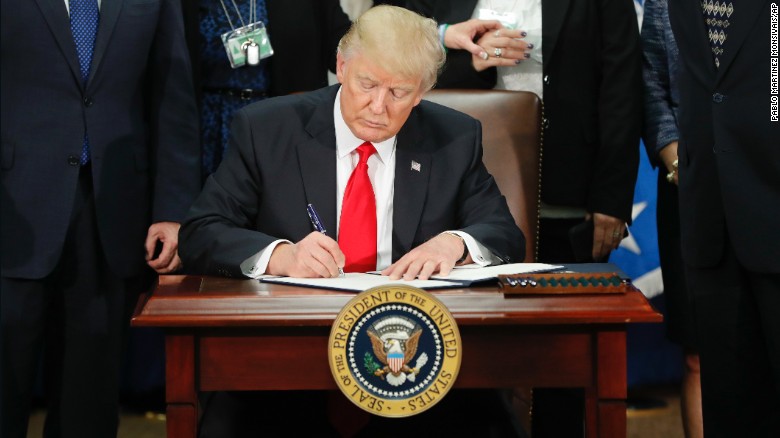 170125134602-01-trump-executive-order-immigration-0125-overlay-tease_267559