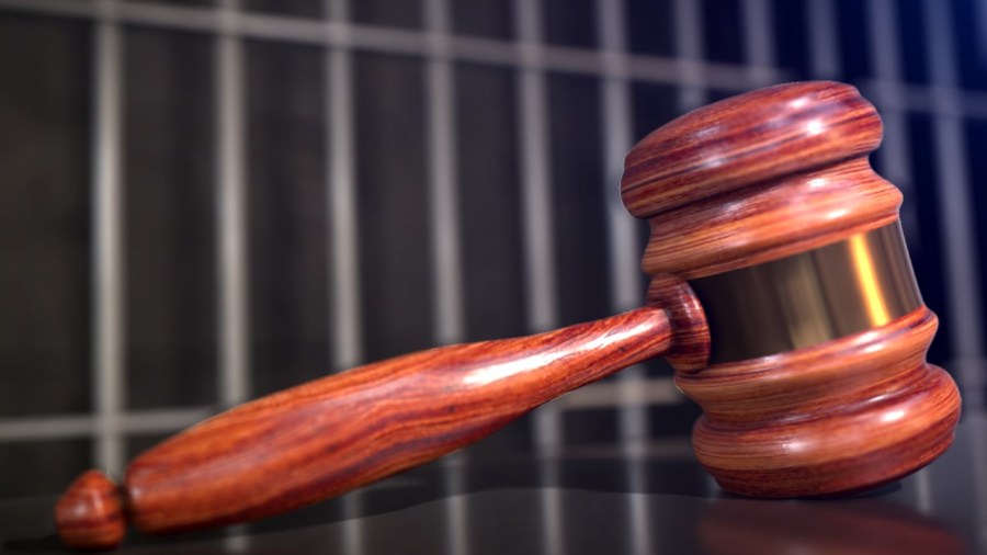 gavel and jail bars