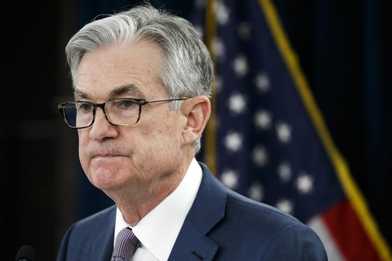 FILE - In this Tuesday, March 3, 2020 file photo, Federal Reserve Chair Jerome Powell pauses during a news conference to discuss an announcement from the Federal Open Market Committee, in Washington. Federal Reserve Chair Jerome Powell expressed optimism Sunday, May 17, 2020 that the U.S. economy can begin to recover from a devastating recession in the second half of the year, assuming the coronavirus doesn't erupt in a second wave. But he suggested that a full recovery won't likely be possible before the arrival of a vaccine.. (AP Photo/Jacquelyn Martin, File)