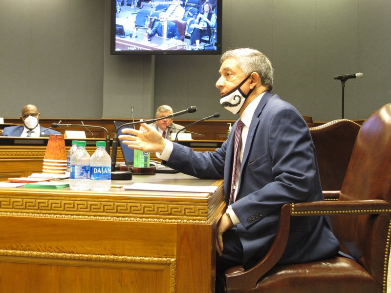 Commissioner of Administration Jay Dardenne, the governor's chief budget adviser, answers questions about the budget on Thursday, May 21, 2020, in Baton Rouge, La. The House Appropriations Committee advanced a package of bills to close a $1 billion state budget gap, largely in line with plans recommended by Gov. John Bel Edwards. (AP Photo/Melinda Deslatte)