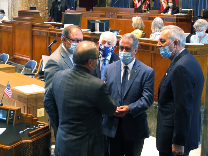 Senators talk on the Senate floor ahead of a debate about Louisiana's budget for the financial year that begins July 1, on Friday, June 26, 2020, in Baton Rouge, La. (AP Photo/Melinda Deslatte)