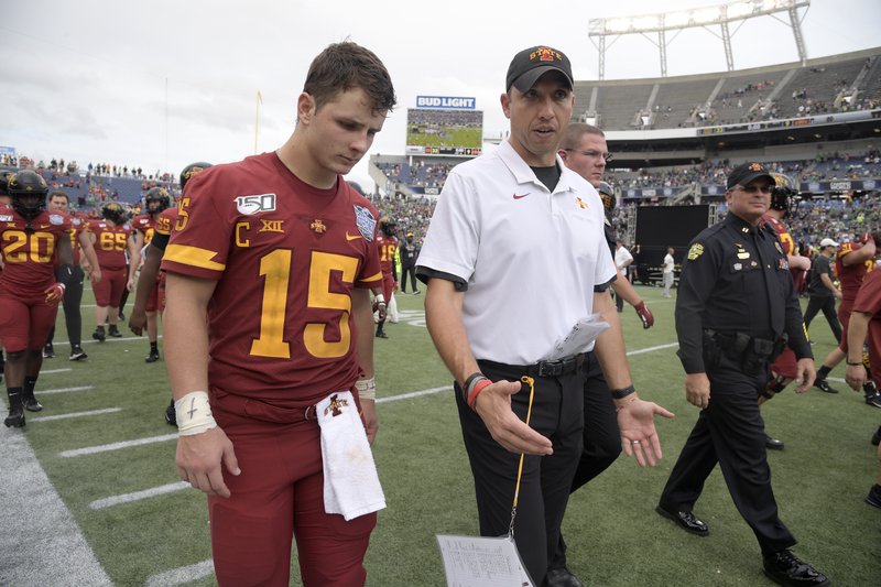 FILE - Iowa State head coach Matt Campbell, center, walks off the field with quarterback Brock Purdy after the Camping World Bowl NCAA college football game against Notre Dame Saturday, Dec. 28, 2019, in Orlando, Fla. Iowa State enters this season off its second-best three-year stretch in program history and with its sights set on doing something it's never done — make the Big 12 championship game. (AP Photo/Phelan M. Ebenhack, File)