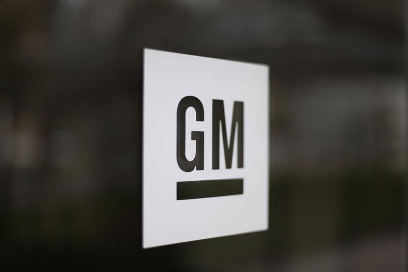 FILE - This Friday, May 16, 2014, file photo, shows the General Motors logo at the company's world headquarters in Detroit. The U.S. is making General Motors recall and repair nearly 6 million big pickup trucks and SUVs equipped with potentially dangerous Takata air bag inflators. The move announced Monday, Nov. 23, 2020, by the National Highway Traffic Safety Administration will cost the automaker an estimated $1.2 billion. (AP Photo/Paul Sancya, File)