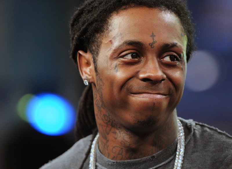 FILE - In this June 10, 2008 file photo, rapper Lil' Wayne makes an appearance on MTV's "Total Request Live" show at MTV Studios in Times Square in New York. Rapper Lil Wayne has pleaded guilty, Friday, Dec. 11, 2020 to a federal charge that he possessed a weapon despite being a convicted felon following a 2019 search of a private plane in the Miami area. (AP Photo/Peter Kramer, File)