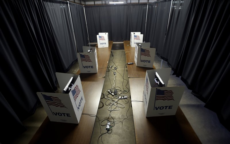 Voting machines are set up and ready for use at the Louisiana Voting Machine Warehouse at 8870 Chef Menteur Hwy. which will be an early voting location in New Orleans, La. Thursday, Oct. 15, 2020. Early voting will run from Oct. 16 to Oct. 27 - except on Sundays - from 8 a.m. to 7 p.m. (Max Becherer/The Times-Picayune/The New Orleans Advocate via AP)