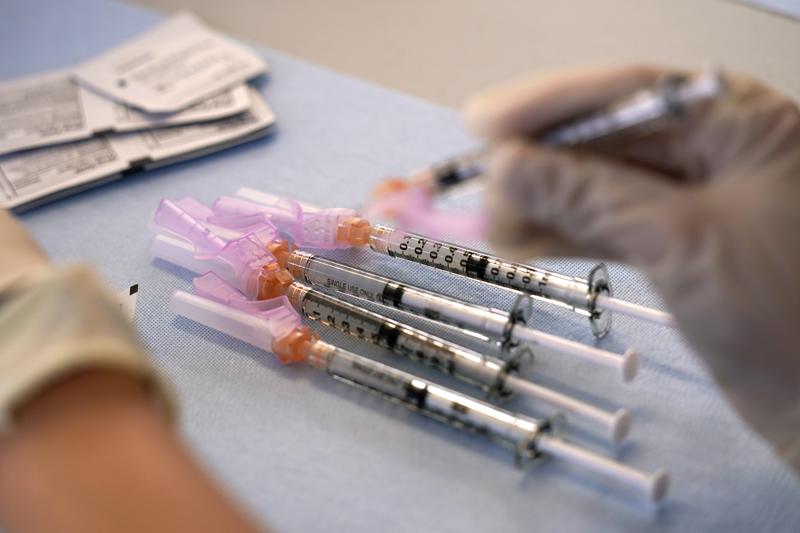 A worker readies syringes with the Moderna COVID-19 vaccine Monday, March 29, 2021, at "Vaccine Fest," a 24-hour COVID-19 mass vaccination event in Metairie, La., just outside New Orleans, hosted by Ochsner Health System and the Jefferson Parish Government. Every adult in Louisiana over the age of 16 is now eligible to get vaccinated against the coronavirus as the state's expanded eligibility went into effect Monday. (AP Photo/Gerald Herbert)
