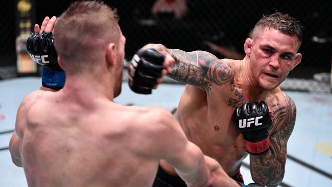 Dustin Poirier (right) punches Dan Hooker of New Zealand during UFC Fight Night at the UFC APEX in Las Vegas on June 27, 2020. Chris Unger/Zuffa LLC via USA TODAY Sports
