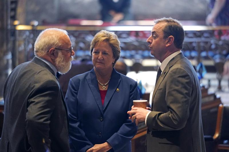 Bret Allain, R-Franklin, left, chairman of the Senate Revenue and Fiscal Affairs Committee, talks with Sen. Sharon Hewitt,R-Slidell, and Sen. Patrick McMath, R-Covington, during opening day of the Louisiana legislative session in Baton Rouge, La., Monday, April 12, 2021. (AP Photo/Gerald Herbert)
