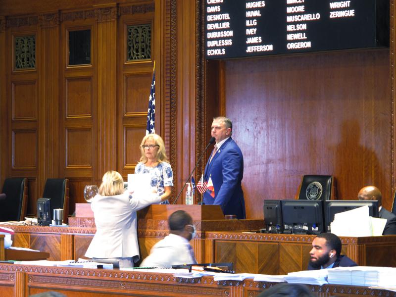 House Speaker Clay Schexnayder, R-Gonzales, standing at the right, looks over the House chamber after speaking with staff at his desk on the last day of the legislative session, Thursday, June 10, 2021, in Baton Rouge, La. (AP Photo/Melinda Deslatte)